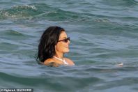 99987451-14873753-She_wore_her_long_dark_hair_down_and_added_shades_to_her_look-a-43_1751609502878.jpg